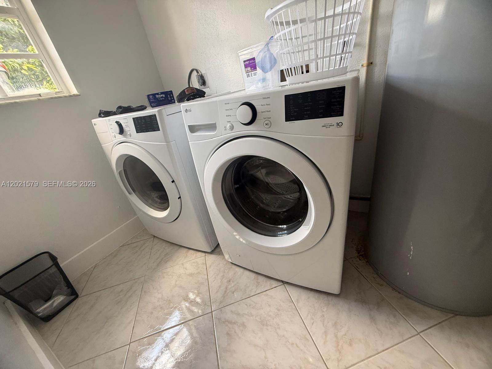 22445 Southwest 264th Street Homestead, FL 33031 - Photo 11 of 12 a utility room with dryer and washer