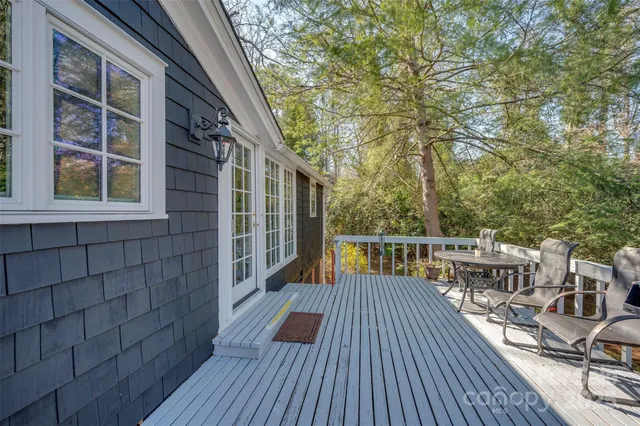 a view of balcony with deck and wooden floor