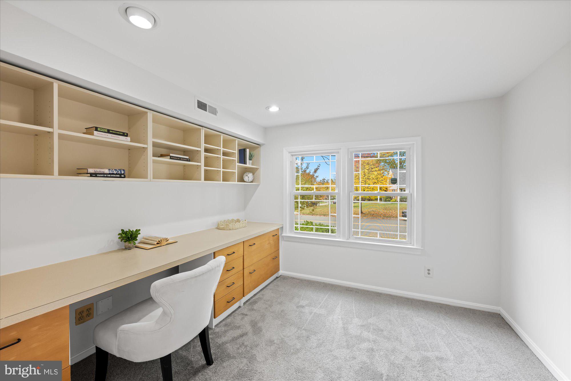 8311 Aqueduct Road Potomac, MD 20854 - Photo 11 of 27 a living room with furniture and a window