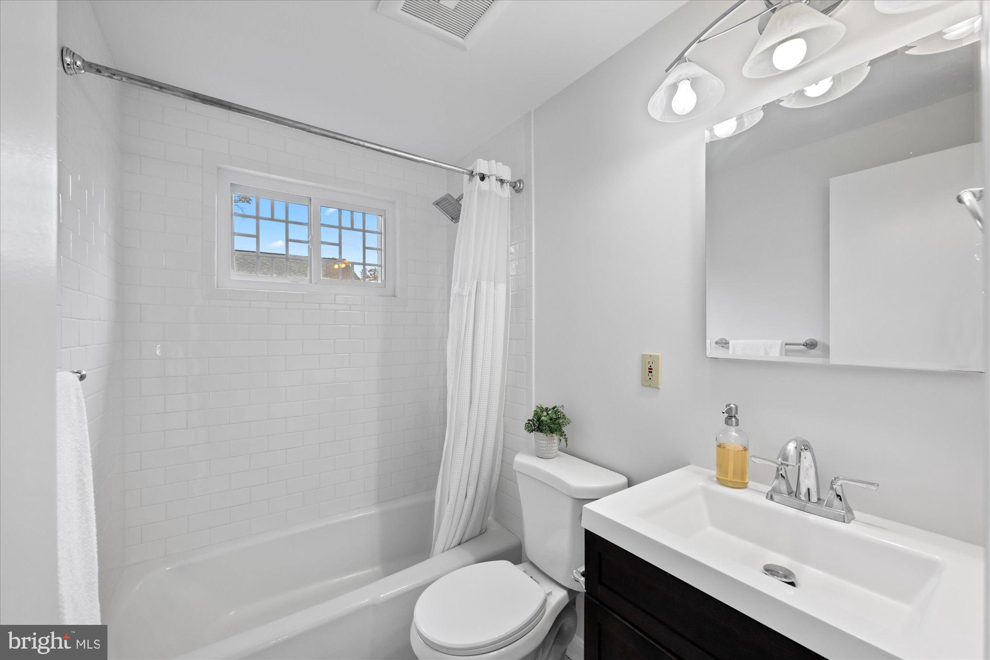 8311 Aqueduct Road Potomac, MD 20854 - Photo 20 of 27 a bathroom with a sink toilet and shower