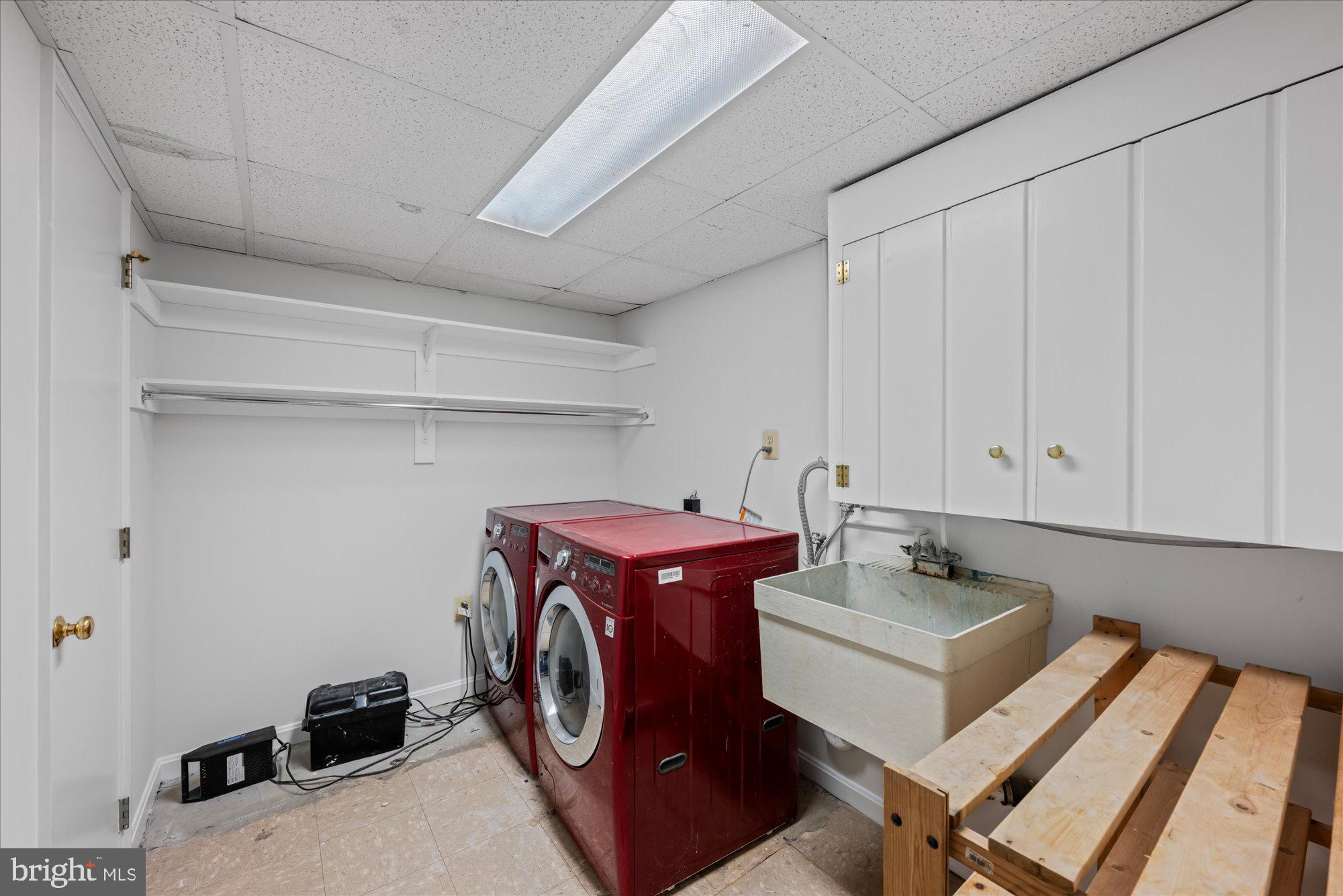 8311 Aqueduct Road Potomac, MD 20854 - Photo 24 of 27 a utility room with dryer and washer