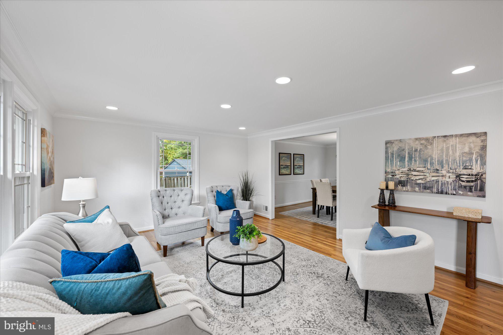 8311 Aqueduct Road Potomac, MD 20854 - Photo 4 of 27 a living room with furniture and a wooden floor