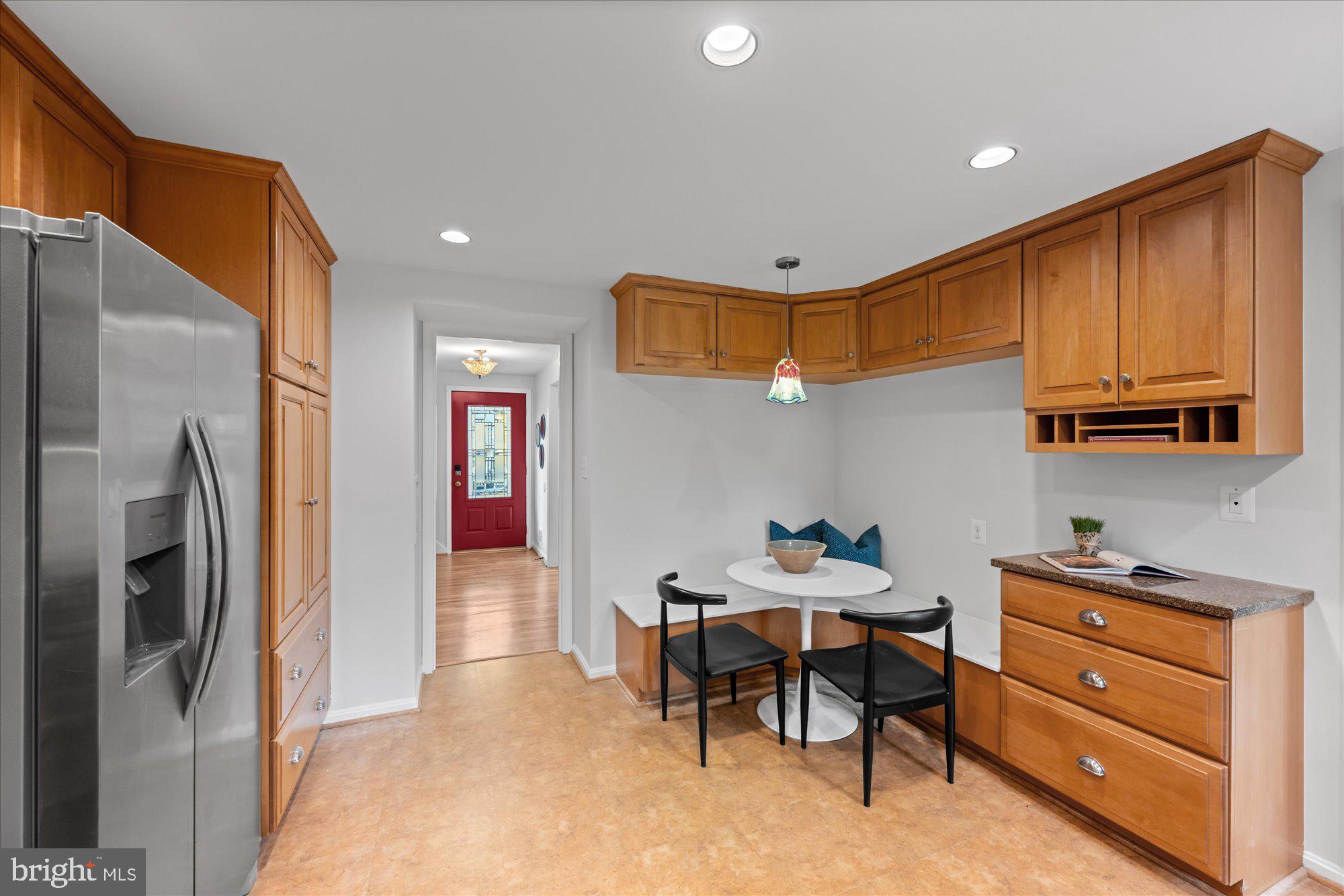 8311 Aqueduct Road Potomac, MD 20854 - Photo 7 of 27 a kitchen that has a lot of cabinets in it and stainless steel appliances
