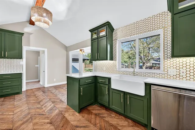 a kitchen with a sink cabinets and window