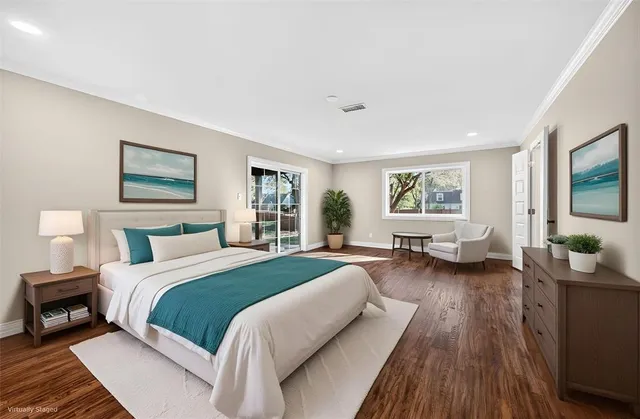 a spacious bathroom with a double vanity sink a mirror and a shower