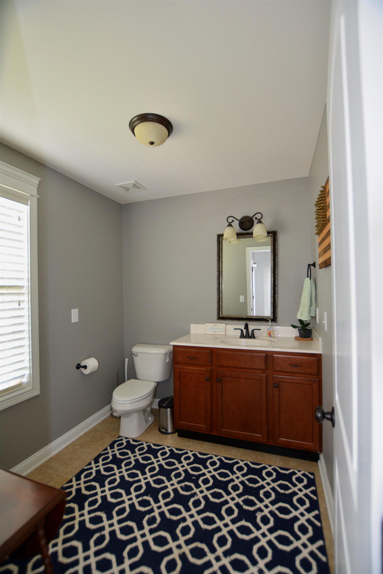 3778 Suiter Road Clarksville, TN 37040 - Photo 8 of 16 a room with a sink and a mirror