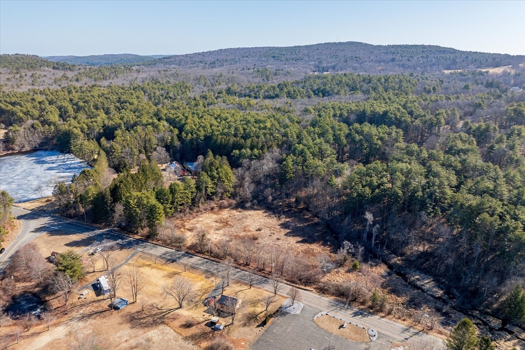 0 Gilbertville Road Ware, MA 01082 - Photo 12 of 17 a view of a lush green hillside and houses