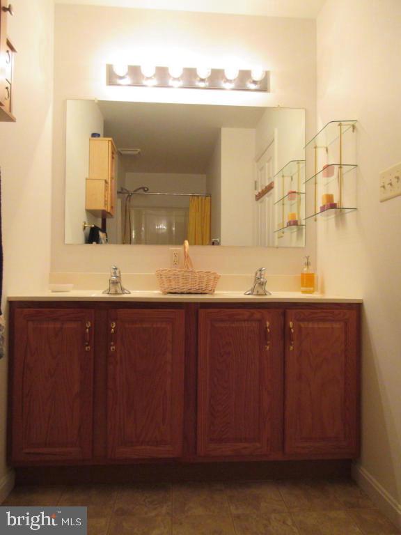 629 Chatham Way Lititz, PA 17543 - Photo 11 of 18 a bathroom with a granite countertop sink and a mirror