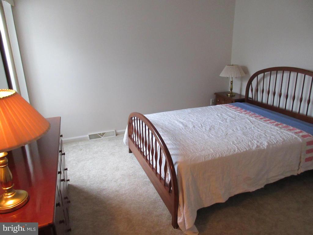 629 Chatham Way Lititz, PA 17543 - Photo 16 of 18 a bedroom with a bed and wooden floor