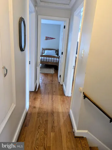 a bedroom with a bed dresser and a window