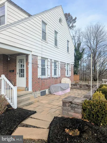 a view of a house with a chairs in patio