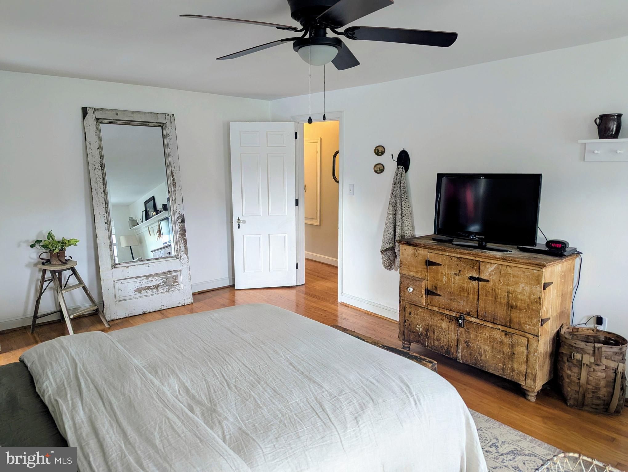 3 Locust Lane Womelsdorf, PA 19567 - Photo 21 of 37 a bedroom with a bed and a flat tv screen on dresser
