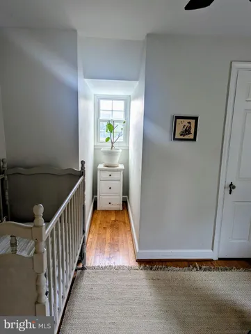 a view of a livingroom with furniture and a flat screen tv