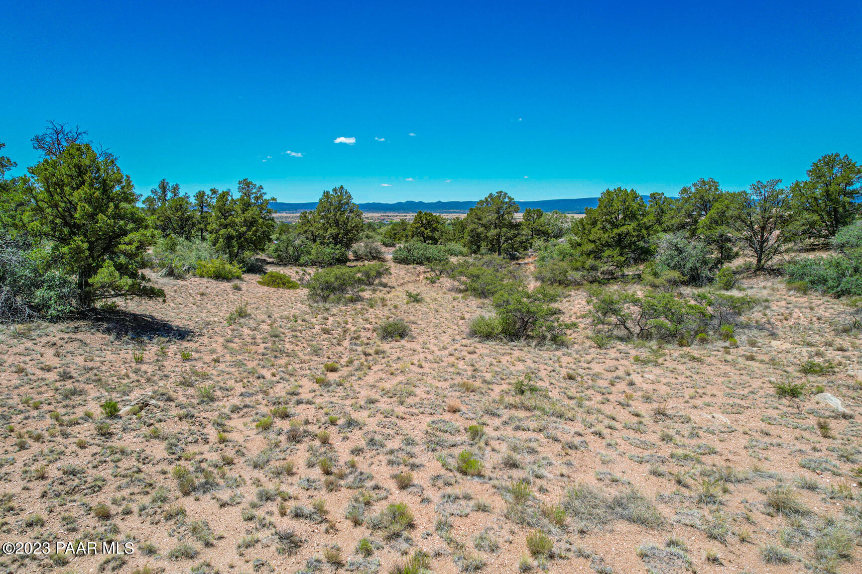 16301 Petroglyph Road Prescott, AZ 86305 - Photo 14 of 32 a view of a beach with a mountain in the background