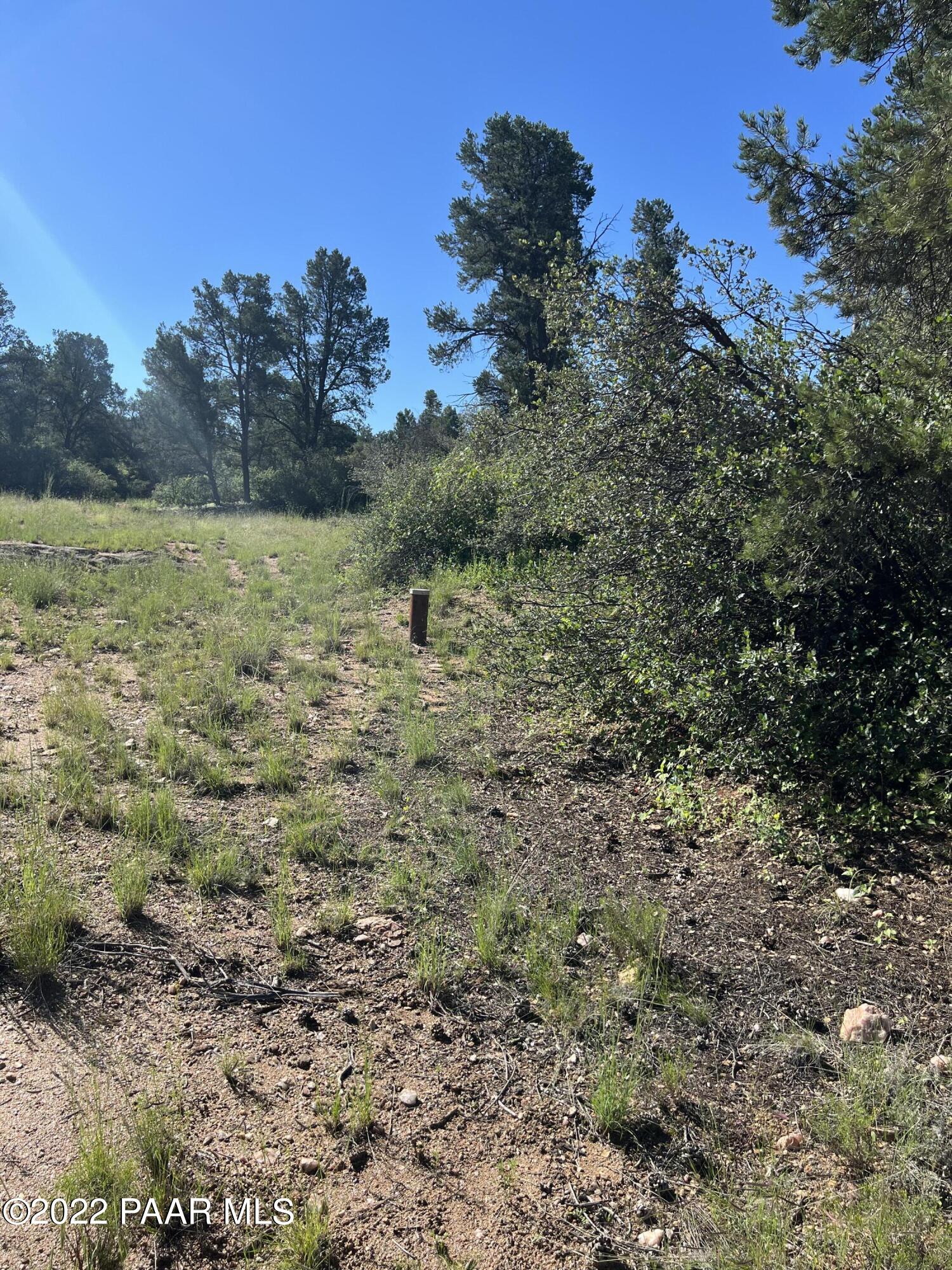 16301 Petroglyph Road Prescott, AZ 86305 - Photo 15 of 32 a view of a lake with a yard