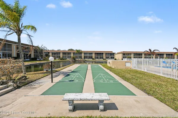 a view of a swimming pool with a lounge chair