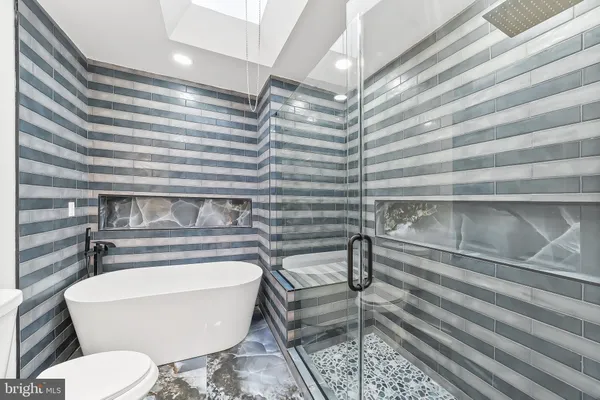 a bathroom with a toilet and a sink