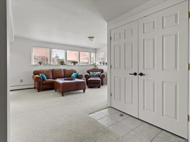 a bedroom with furniture and window