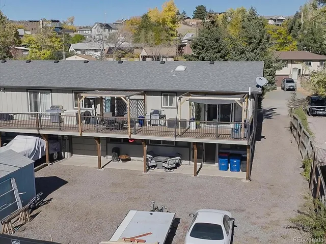 an aerial view of a house with sitting area