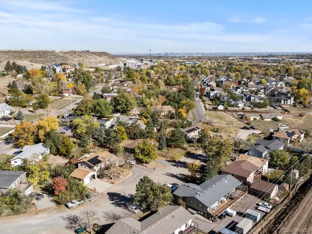 an aerial view of residential houses and outdoor space
