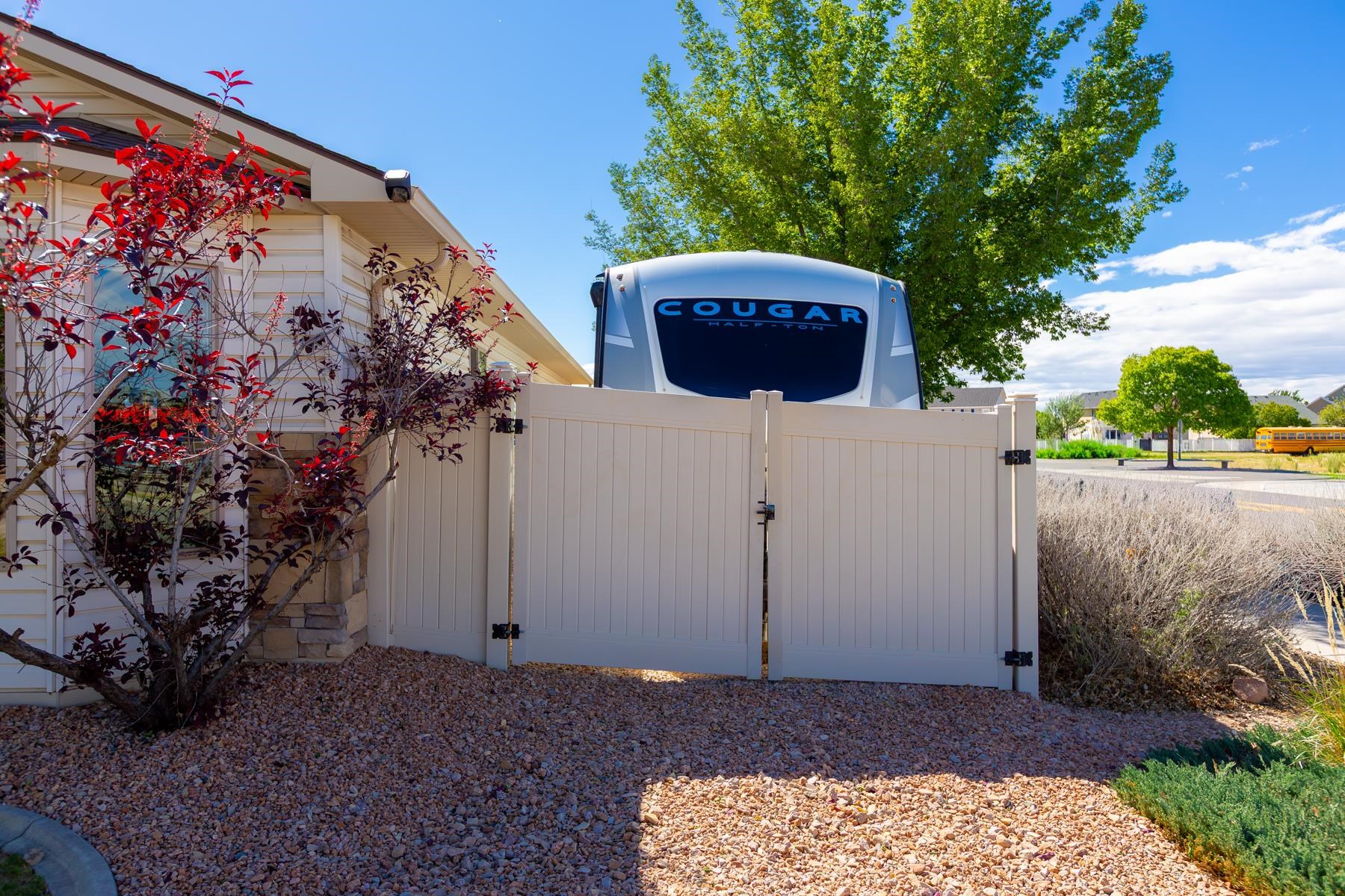 103 Red Rocks Street Fruita, CO 81521 - Photo 4 of 39 a view of a backyard with a garden