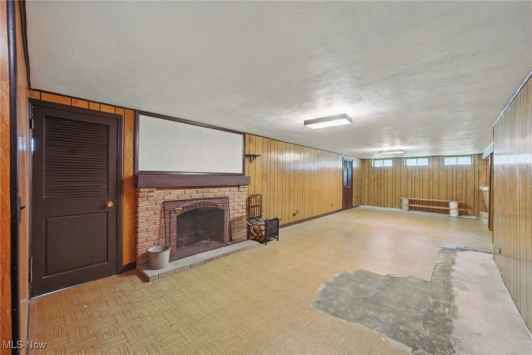 531 Ransome Road Cleveland, OH 44143 - Photo 19 of 27 Full basement has recreation room with wet bar, laundry room, work area and tons of storage. 2-car attached garage with new garage door opener in 06/24.