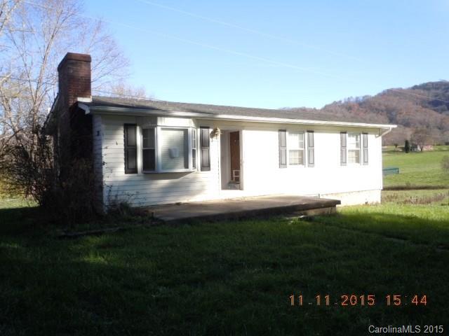 310 Howell Road, Unit 2 Canton, NC 28716 - Photo 1 of 5 a front view of a house with a garden