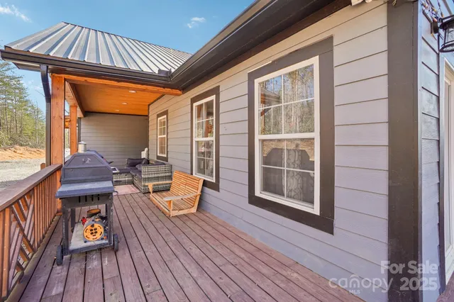 a view of a house with a yard and sitting area