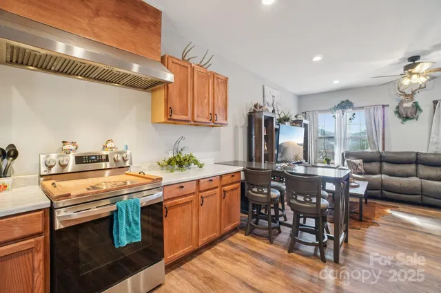 a kitchen that has a table and chairs in it