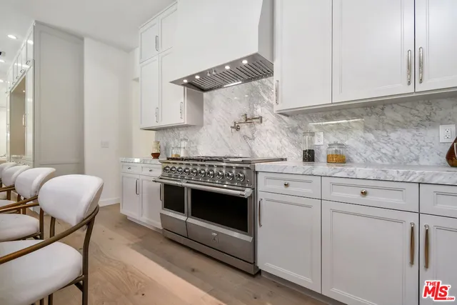 a kitchen with cabinets and appliances