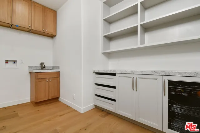 a view of cabinets and wooden floor