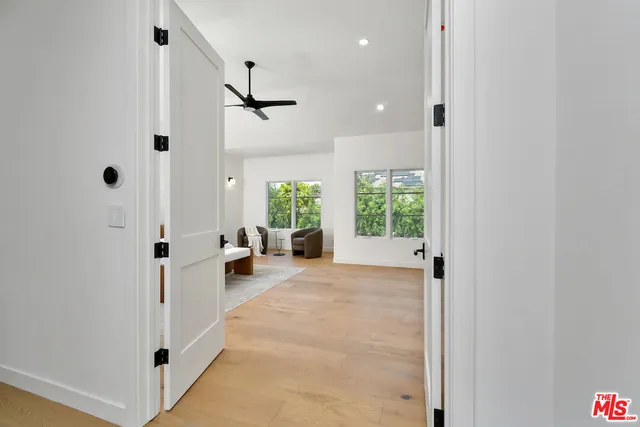 a very nice looking room with a large window and chandelier