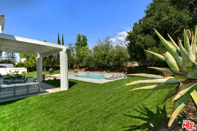 a view of a swimming pool with a patio