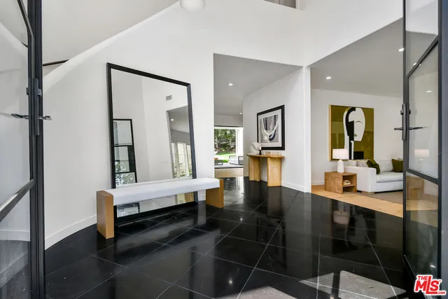 a lobby with furniture and wooden floor