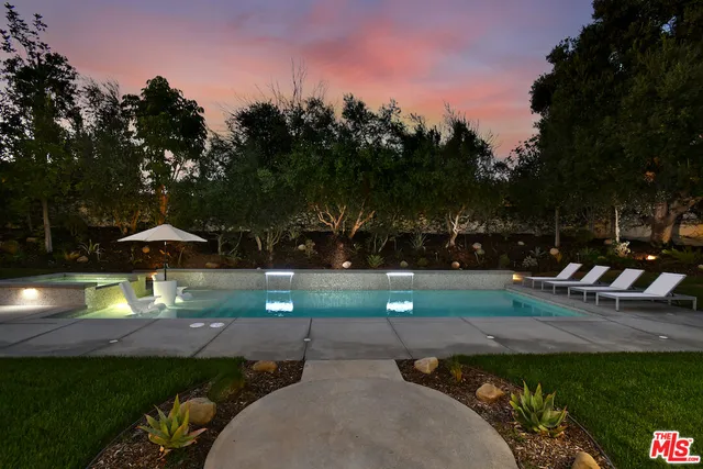 a view of a park with large trees