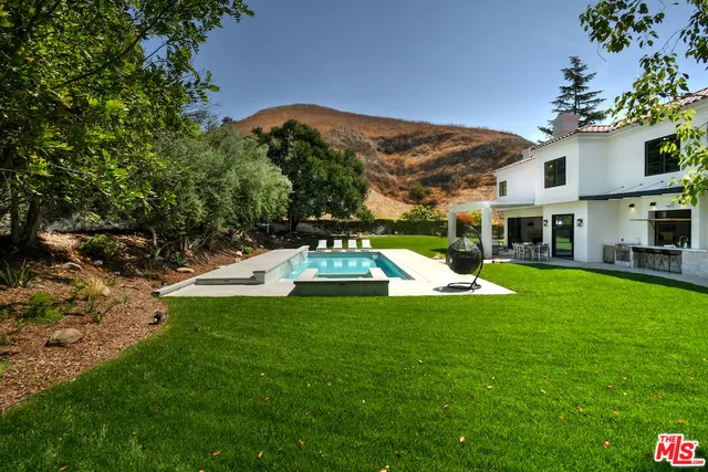 a view of a house with a swimming pool
