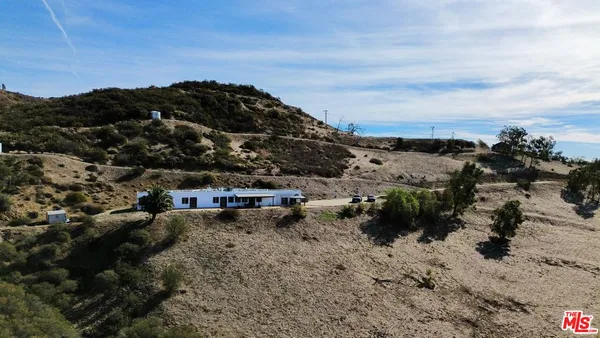 a view of a town with mountains in the background