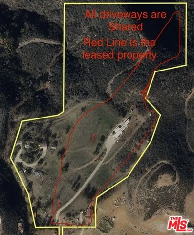 an aerial view of residential house with outdoor space