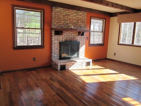 230 West Street Paxton, MA 01612 - Photo 3 of 23 a view of an empty room with wooden floor and a window
