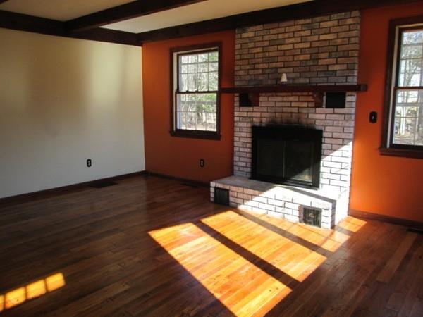 230 West Street Paxton, MA 01612 - Photo 4 of 23 a living room with furniture a fireplace and a flat screen tv
