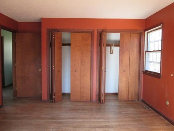 230 West Street Paxton, MA 01612 - Photo 8 of 23 an empty room with wooden floor and windows