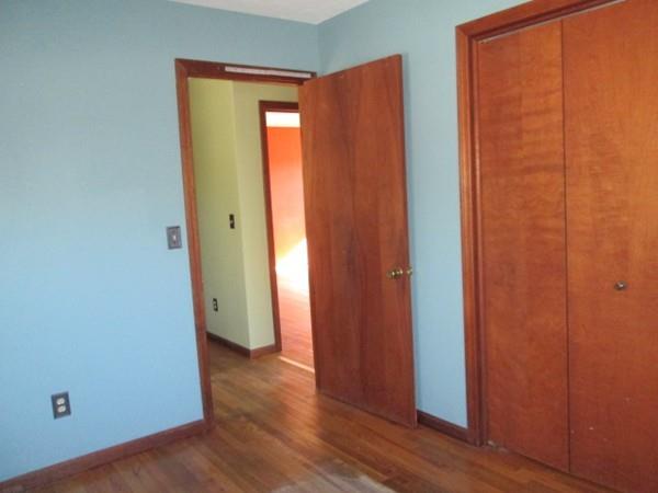 230 West Street Paxton, MA 01612 - Photo 9 of 23 an empty room with wooden floor and closet area