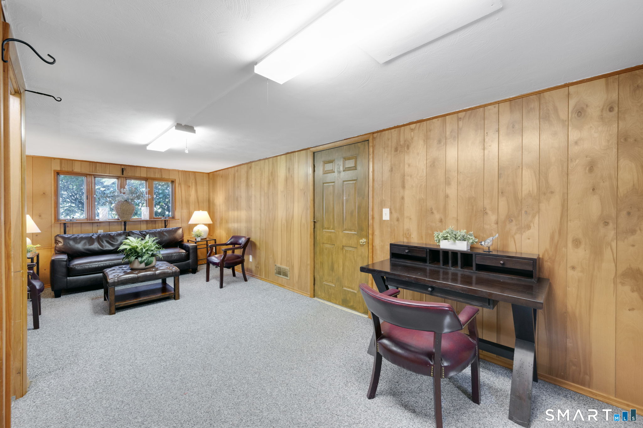 203 Brentwood Road Newington, CT 06111 - Photo 25 of 39 Large room just off the attached garage at ground level. Multiple uses possible based on your needs. Dining Room, Playroom, Office. TV Room. The basement is accessed through here. A door to the basement is available.