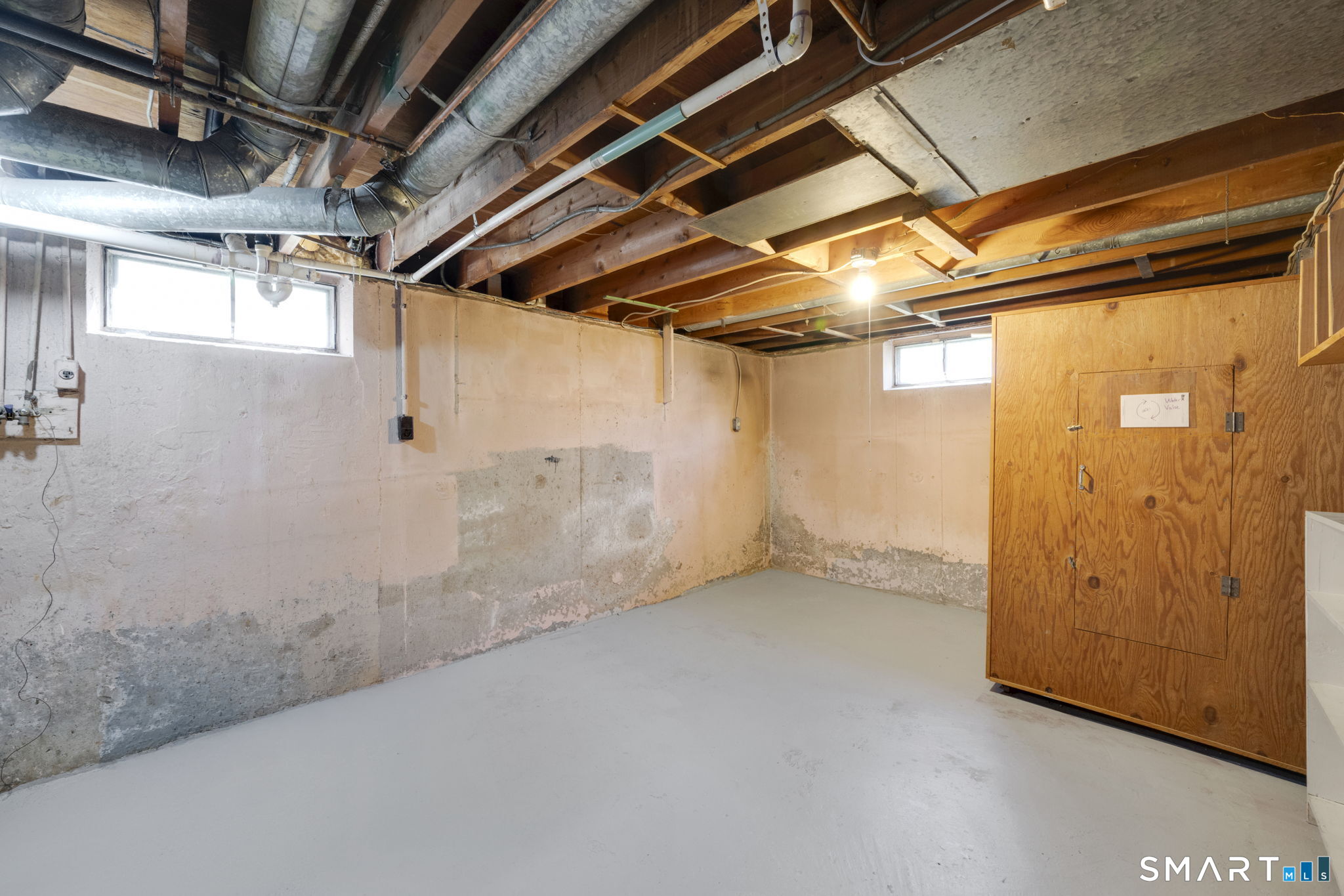 203 Brentwood Road Newington, CT 06111 - Photo 29 of 39 Clean and dry basement was well-maintained. Washer and Dryer hookups are here, easily accessible. Washer and dryer are not included in the sale.