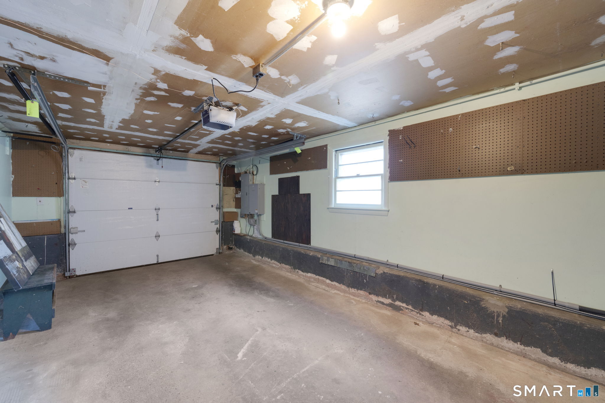 203 Brentwood Road Newington, CT 06111 - Photo 32 of 39 Attached garage. Easy to enter the house during inclement weather! Automatic garage door opener included.