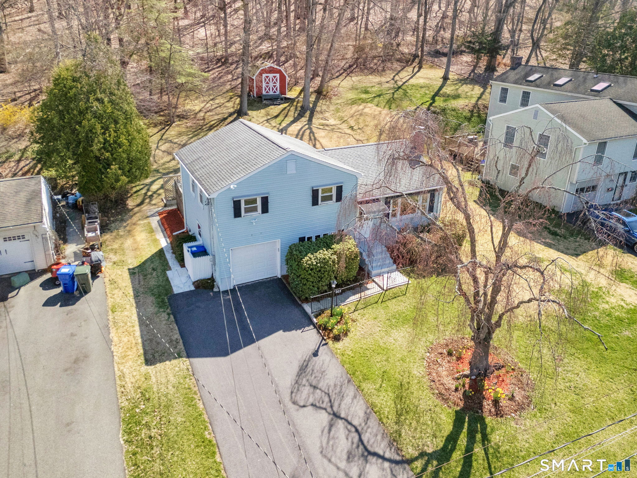 203 Brentwood Road Newington, CT 06111 - Photo 33 of 39 Lovely grounds, including a very well-maintained weeping cherry tree and rhododendrons.