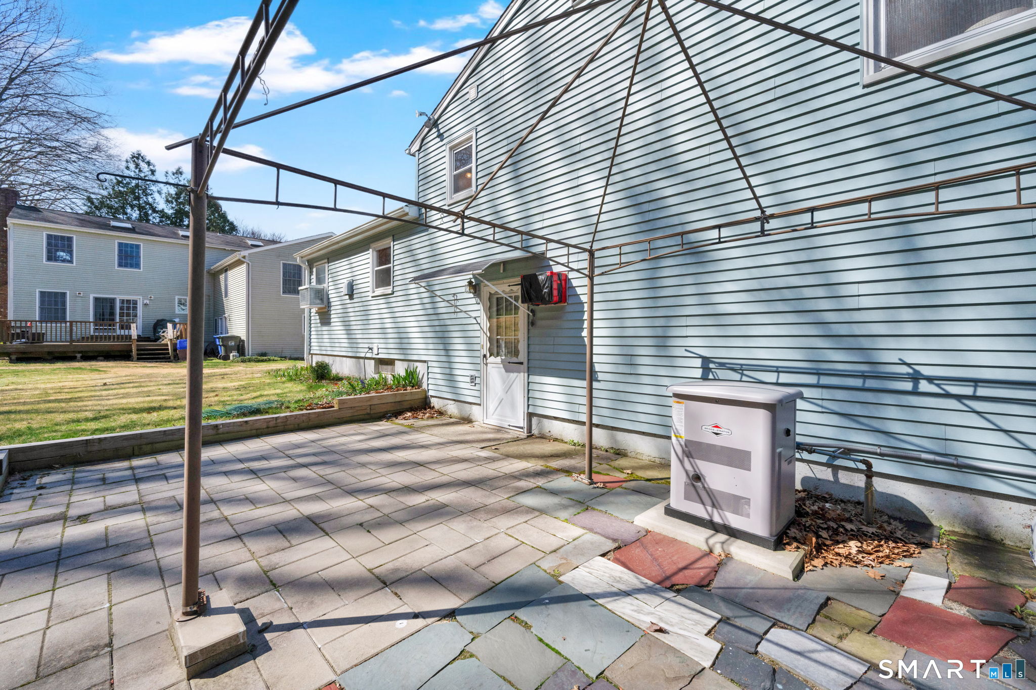 203 Brentwood Road Newington, CT 06111 - Photo 39 of 39 Back of house with generator and gazebo.