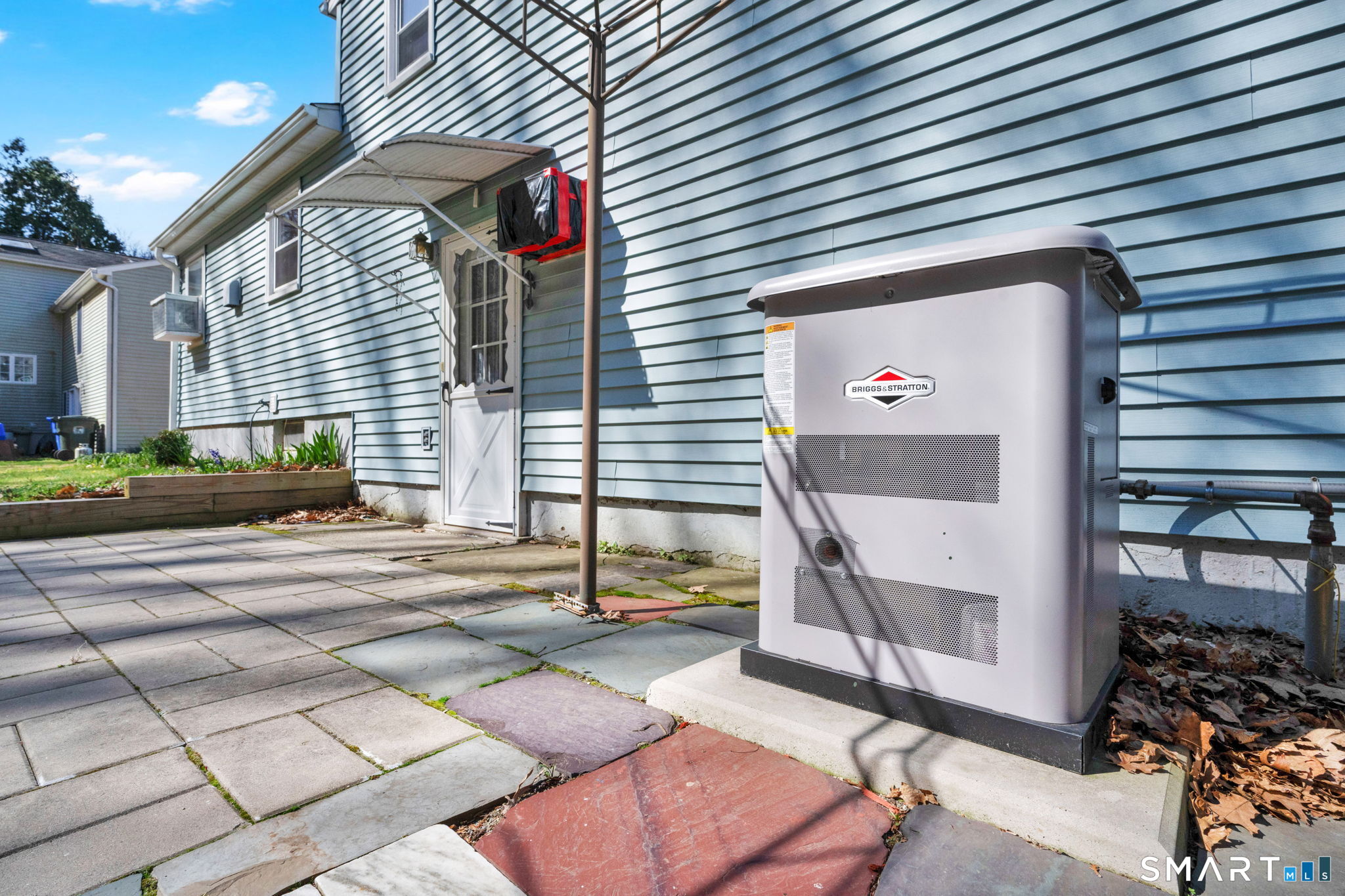 203 Brentwood Road Newington, CT 06111 - Photo 5 of 39 Backyard, patio and generator, run by propane.