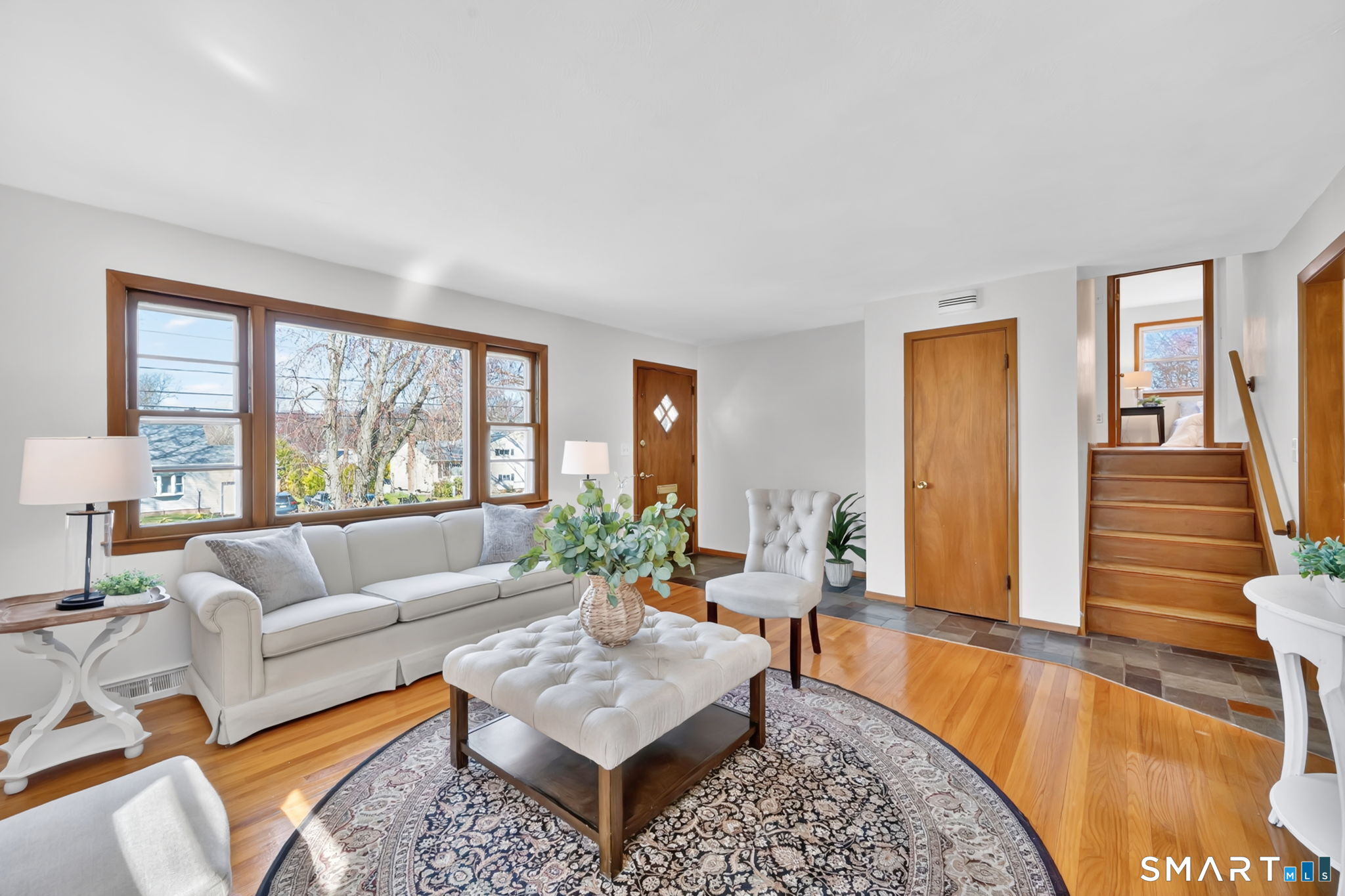 203 Brentwood Road Newington, CT 06111 - Photo 8 of 39 Living Room looking up stairs to bedroom/bathroom level.