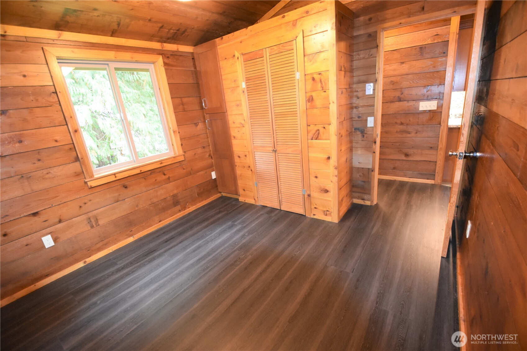 30331 Heimer Road Arlington, WA 98223 - Photo 29 of 37 a view of an empty room with wooden floor and a window